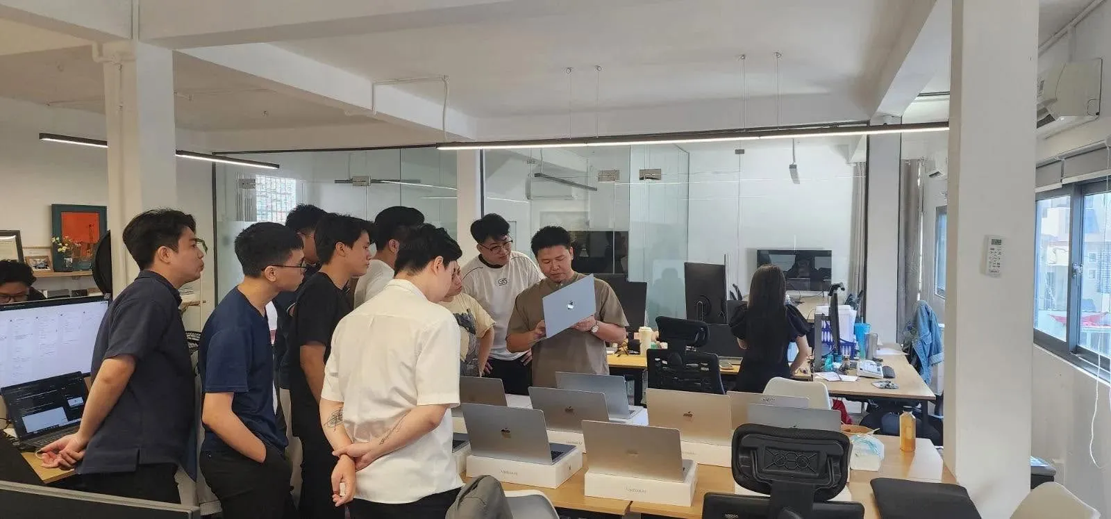A huddle in the Saigon office